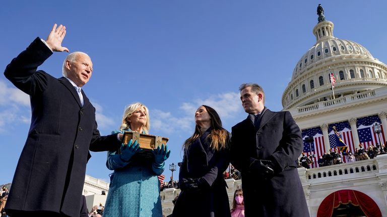 Joe Biden is sworn in as the 46th president of the United States by Chief Justice John Roberts as Jill Biden holds the Bible during the 59th Presidential Inauguration at the U.S. Capitol in Washington, U.S., January 20, 2021. Andrew Harnik/Pool via REUTERS