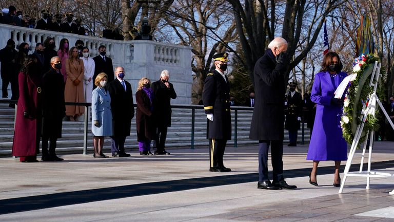 Joe Biden and Kamala Harris stand in front of former US presidents at a wreath laying ceremony