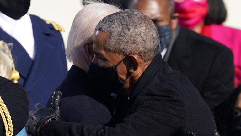 Former U.S. President Barack Obama embraces U.S. President Joe Biden during the inauguration of Biden as the 46th President of the United States on the West Front of the U.S. Capitol in Washington, U.S., January 20, 2021. REUTERS/Kevin Lamarque