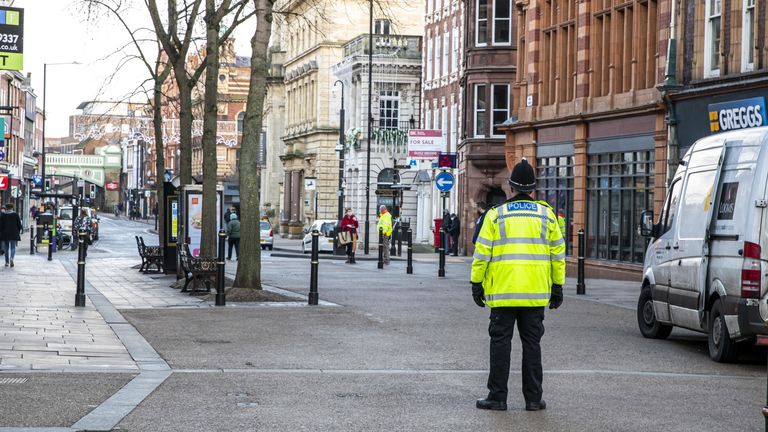 A police officer patrols an empty High Street in Worcester city centre, Worcestershire, on the first day of the third national lockdown in England, to reduce the spread of COVID-19. Prime Minister Boris Johnson announced further coronavirus restrictions during a televised address to the nation last night.