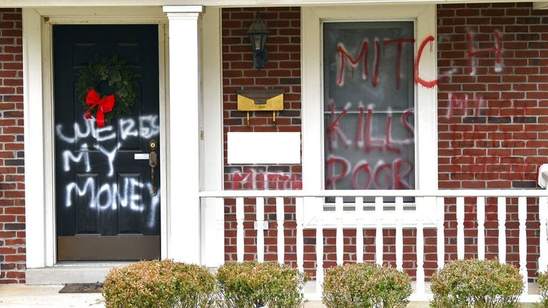 The home of Senate Majority Leader Mitch McConnell is shown as it was vandalized overnight in Louisville, Ky., Saturday, Jan. 2, 2021. (AP Photo/Timothy D. Easley)