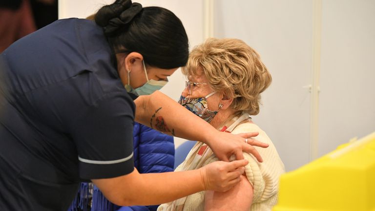 Moira Edwards receives the Oxford/AstraZeneca vaccine at the centre in Epsom