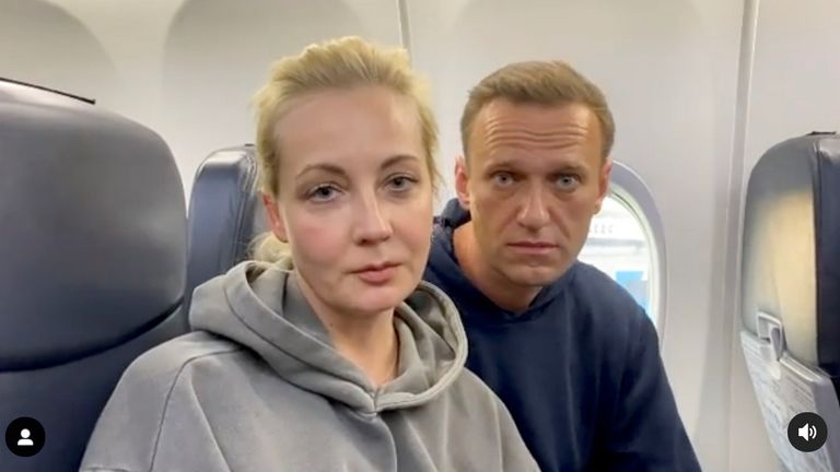 Russian opposition politician Alexei Navalny and his wife Yulia are seen in a still image from video on board of a plane before the departure for Moscow at an airport in Berlin, Germany January 17, 2021 in this still image from video obtained from social media. Pic: Instagram @NAVALNY