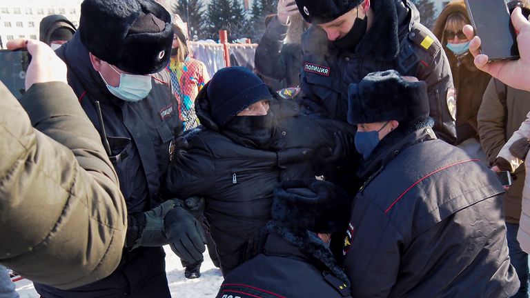 Police detain a man  in Khabarovsk, Russia, during a protest against the jailing of Alexei Navalny. Pic: AP