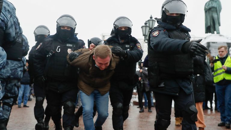 Police detain a man in Moscow. Pic: AP