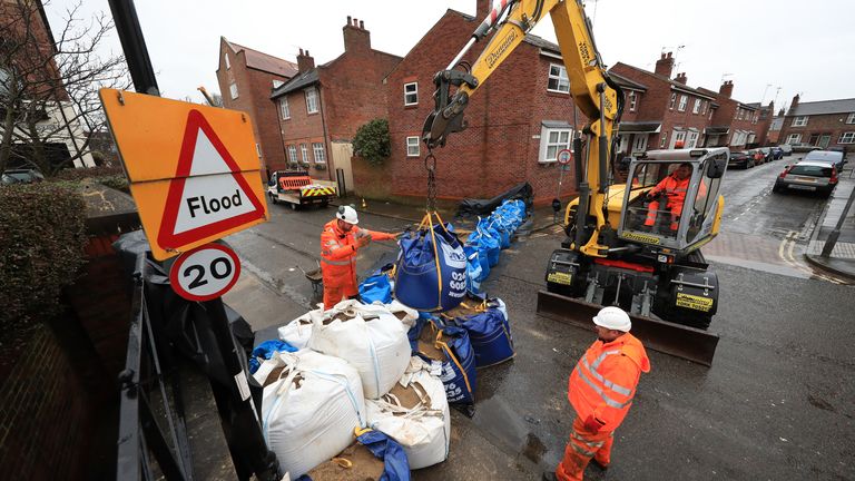 Workmen prepare flood defences near the River Ouse, York, as Storm Christoph is set to bring widespread flooding, gales and snow to parts of the UK. Heavy rain is expected to hit the UK overnight on Tuesday, with the Met Office warning homes and businesses are likely to be flooded, causing damage to some buildings. Picture date: Tuesday January 19, 2021.