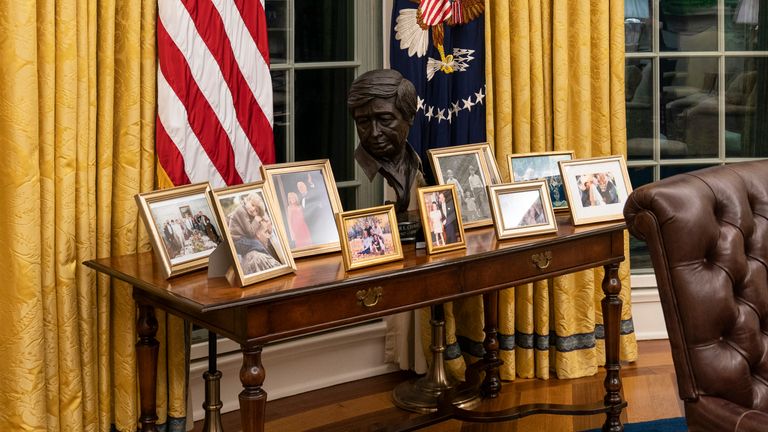 The president has a table filled with family photos. Pic: AP