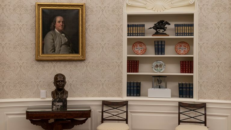 On the the table is a bust of former President Harry Truman and to the right is a rock from the moon on a shelf. Pic: AP