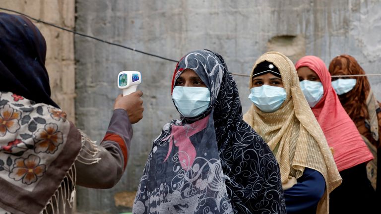 Vaccinators get their temperature checked during last year&#39;s anti-polio drive