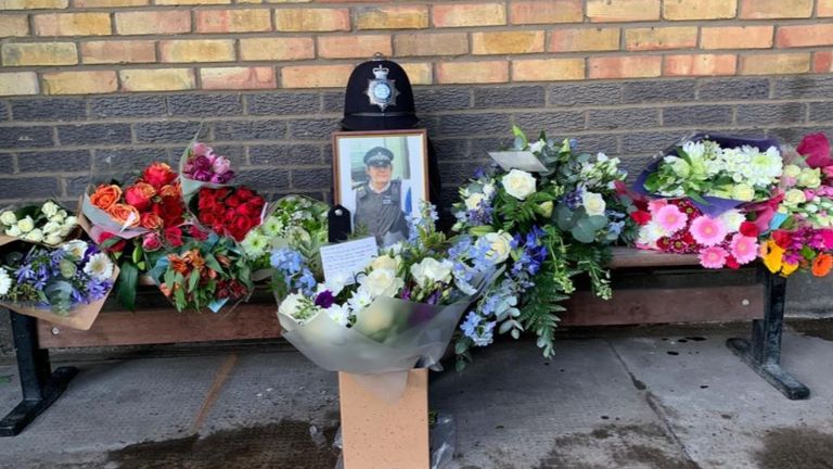Tributes left to PC John Fabrizi. Pic: @MPSCamden/Twitter