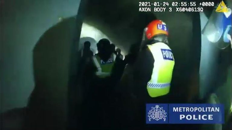 Officers break into a space being used for an illegal rave