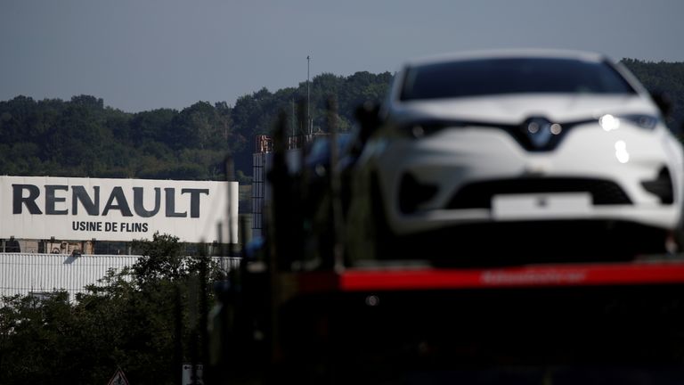 A car carrier transporting Renault ZOE cars leaves the Flins plant of French carmaker Renault in Aubergenville, west of Paris, following the outbreak of the coronavirus disease (COVID-19) in France, May 26, 2020