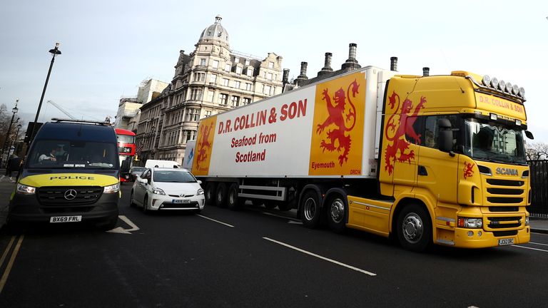 A lorry drives during a protest against post-Brexit bureaucracy that hinders exports to the European Union, at the Parliament Square in London, Britain, January 18, 2021. REUTERS/Hannah McKay