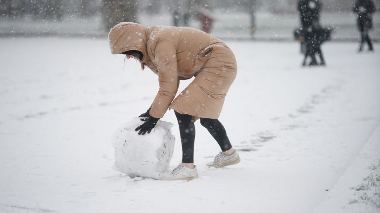 People in the snow in Battersea Park, London

