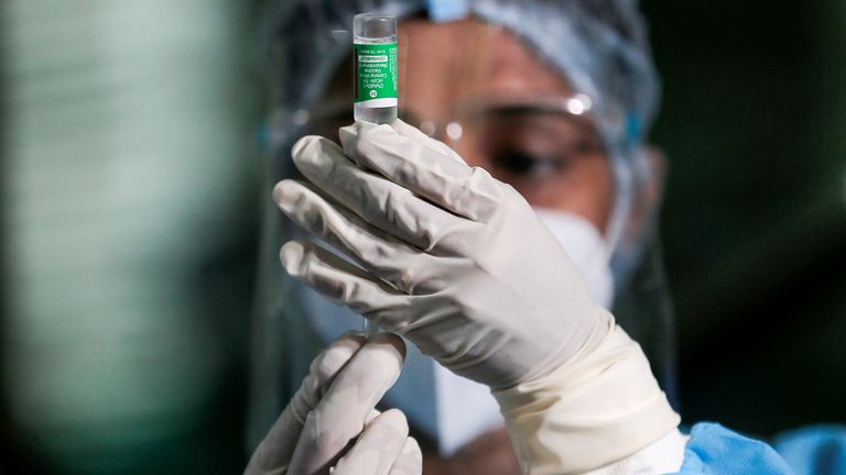 A health official draws a dose of the AstraZeneca&#39;s COVID-19 vaccine manufactured by the Serum Institute of India