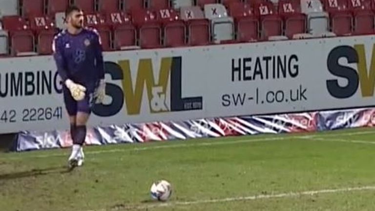 Newport County keeper Tom King scores from a goal kick