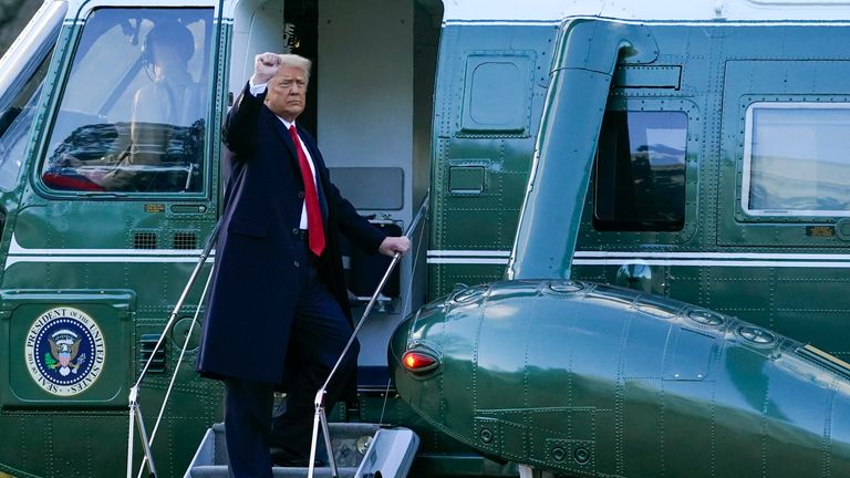 President Donald Trump gestures as he boards Marine One on the South Lawn of the White House, Wednesday, Jan. 20, 2021, in Washington. Trump is en route to his Mar-a-Lago Florida Resort. (AP Photo/Alex Brandon) 