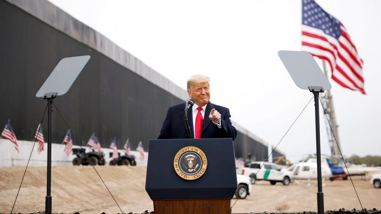 President Donald Trump gestures as he speaks during a visit at the U.S.-Mexico border wall, in Alamo, Texas,