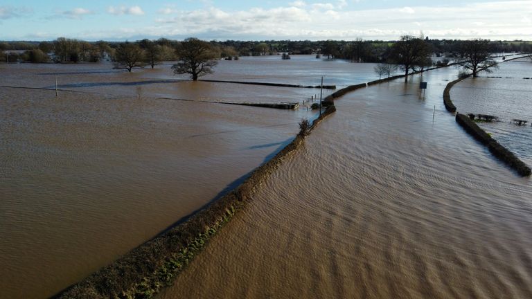 A flooded road and fields are seen after storm Christoph arrived in Bangor-on-Dee, Britain, January 21, 2021. Picture taken with a drone. REUTERS/Phil Noble