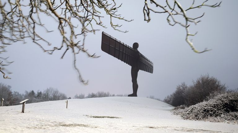 the 20 metre tall Angel of the North sculpture, designed by Antony Gormley, in Gateshead, Tyne and Wear, during the night after heavy snow blanketed much of the north of England.