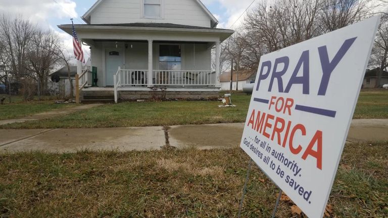 Many houses in the town had politica signs outside.