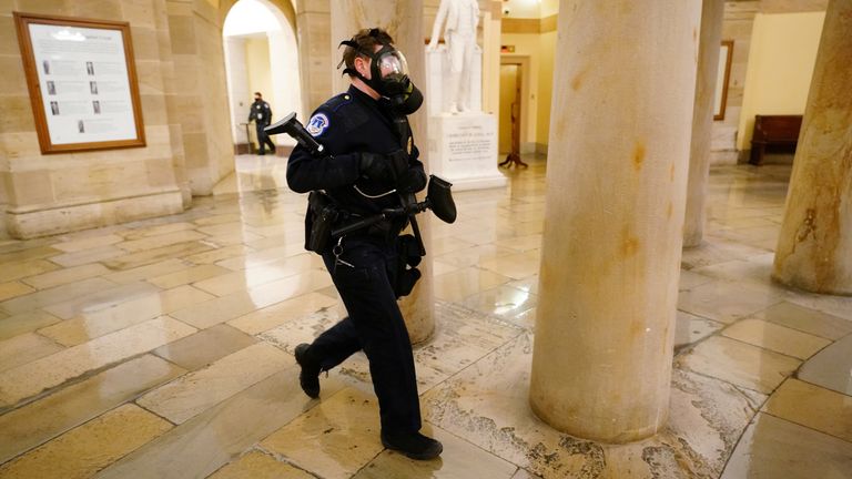 U.S. Capitol police officers take positions as protestors enter the Capitol building during a joint session of Congress to certify the 2020 election results on Capitol Hill in Washington, U.S., January 6, 2021. Kevin Dietsch/Pool via REUTERS