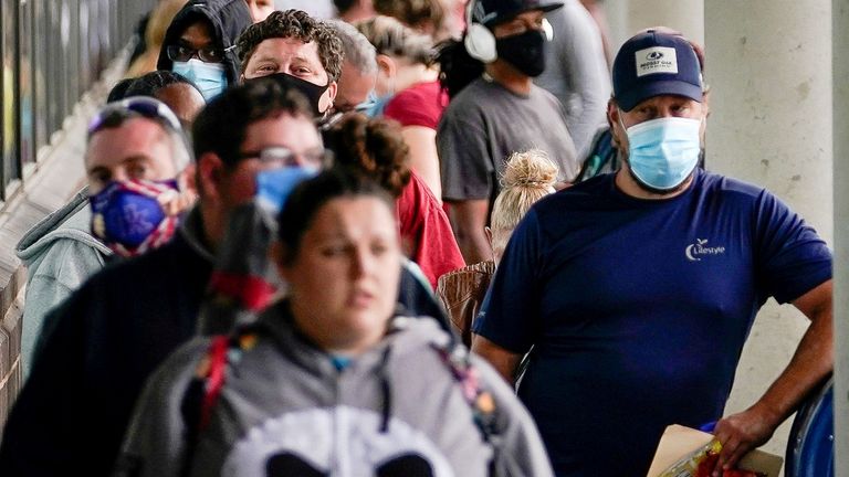 Hundreds of people line up outside a Kentucky Career Center hoping to find assistance with their unemployment claim in Frankfort, Kentucky, U.S. June 18, 2020