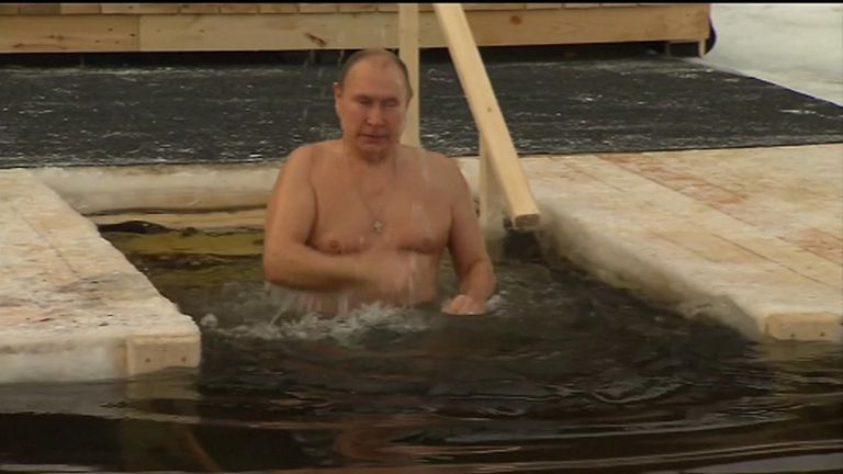 Putin braves icy waters to take part in traditional Epiphany dip