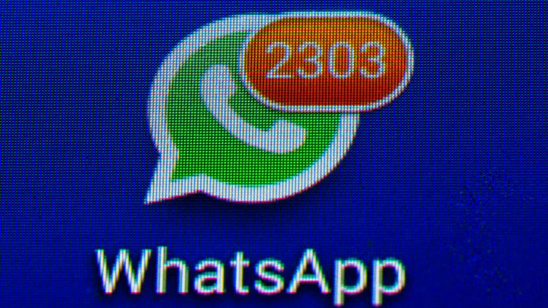 30 December 2020, Berlin: The logo of the app WhatsApp shows the number of 2303 unread messages above the lettering and the white-green logo with telephone receiver. Photo by: Soeren Stache/picture-alliance/dpa/AP Images


