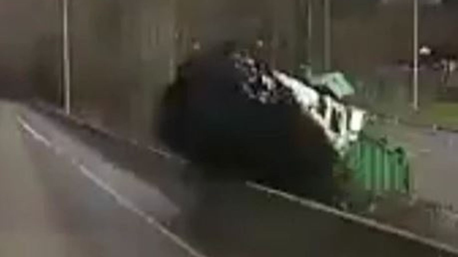 Moment truck smashes into barrier on busy US motorway | US News | Sky News