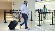 Ted Cruz at Cancun airport, Mexico, as he heads back to United States