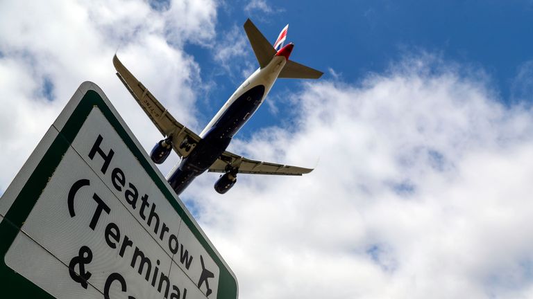 A British Airways plane lands at Heathrow in London, as new quarantine measures for international arrivals come into force.