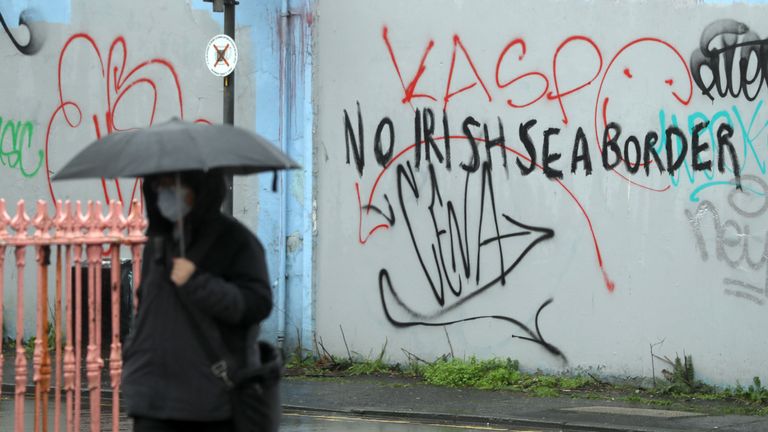 Graffiti reading 'No Irish Sea border' Stroud Street in Belfast. The DUP has rejected claims it is whipping up tensions over Irish Sea trade in an effort to get Brexit's contentious Northern Ireland Protocol ditched. Physical inspections on goods entering Northern Ireland from Great Britain, which are required under the protocol, have been suspended amid threats and intimidation of staff. Picture date: Wednesday February 3, 2021.