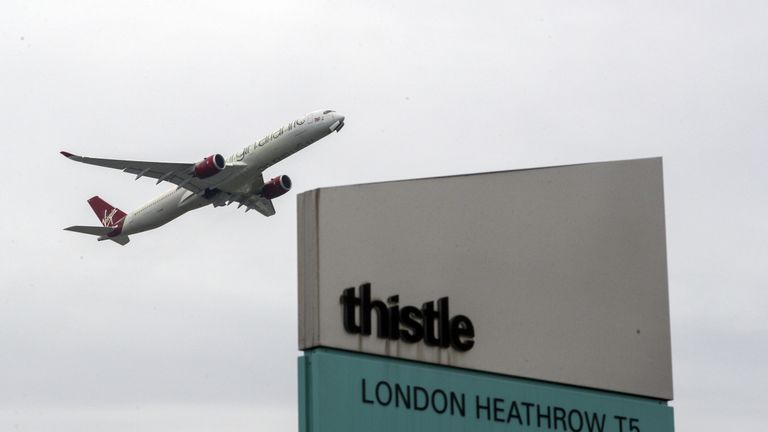 A plane passes over the Thistle Hotel at Heathrow. Prime Minister Boris Johnson is expected to approve plans to force some travellers arriving to the UK to quarantine in hotels to limit the spread of new coronavirus variants. Picture date: Tuesday January 26, 2021.