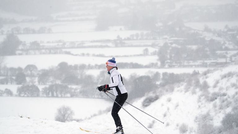 A skier makes their way through the snow in Wye National Nature Reserve near Ashford in Kent, with heavy snow set to bring disruption to south-east England and East Anglia as bitterly cold winds grip much of the nation. Picture date: Sunday February 7, 2021.