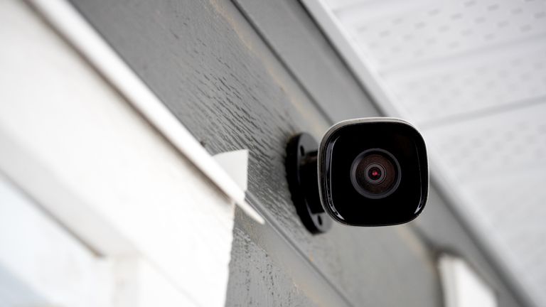 Black cctv outside the building, home security system