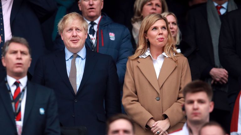 Prime Minister Boris Johnson and partner Carrie Symonds in the stands during the Guinness Six Nations match at Twickenham Stadium, London.