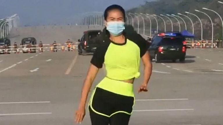 Khing Hnin Wai films a regular aerobics video, while a military coup takes place in the background