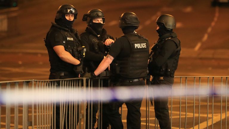 Armed police at Manchester Arena after reports of an explosion at the venue during an Ariana Grande gig.
