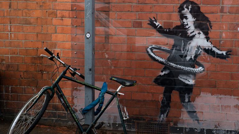 An artwork painted by Banksy on the side of a property at Rothesay Avenue and Ilkeston Road in Nottingham, which has had a replacement bicycle after the original was reportedly stolen over the weekend. Picture date: Monday 23rd November 2020. Photo credit should read: Jacob King/PA Wire
