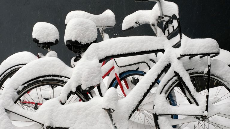 Bicycles covered in snow in Nijmegen in the Netherlands