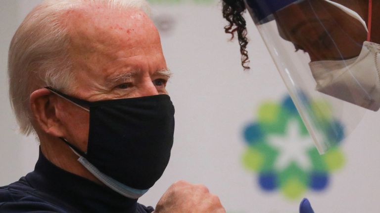 Nurse practitioner Tabe Mase gives U.S. President-elect Joe Biden a dose of a vaccine against the coronavirus disease (COVID-19) at ChristianaCare Christiana Hospital, in Newark, Delaware, U.S. December 21, 2020. REUTERS/Leah Millis
