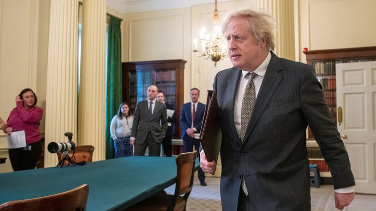 Britain&#39;s Prime Minister Boris Johnson arrives to host the Online G7 Summit in the Cabinet Room at Downing Street in London, Britain February 19, 2021. Geoff Pugh/Pool via REUTERS