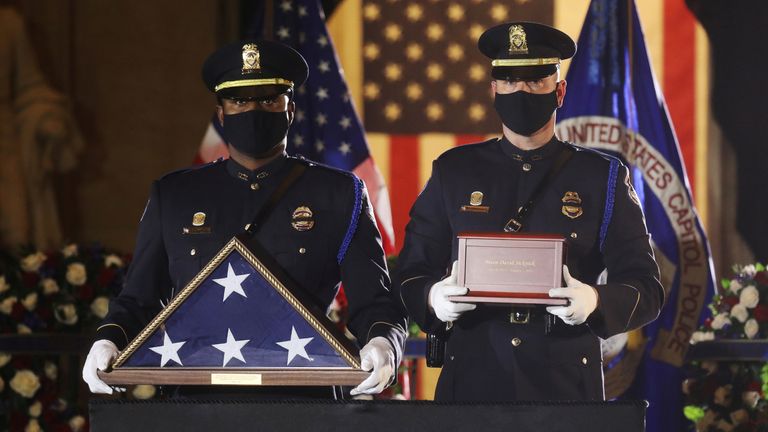 U.S. Capitol Police Officers carry the urn holding the remains of fellow officer Brian Sicknick, who died on January 7 from injuries he sustained while protecting the U.S. Capitol during the January 6 attack on the building, to lie in honor in the Capitol Rotunda at the U.S. Capitol in Washington, U.S., February 2, 2021. REUTERS/Leah Millis/Pool