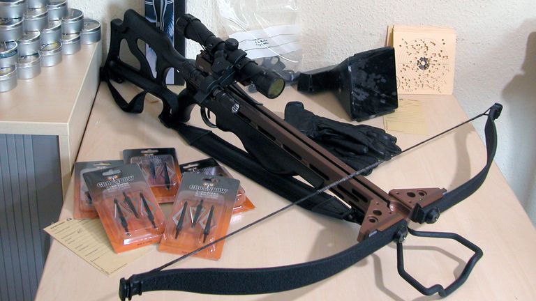 A secured cross bow, munition and weapon accessories are presented at a police press conference in Jena, Germany, 08 May 2013. A caught alleged animal abuser from Thuringia drew the police&#39;s attention to himself through the purchase of weapons over the internet. Photo: KATRIN ZEIß