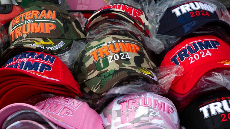 Supporters of former President Donald J. Trump line up the motorcade route to his Palm Beach Estate, Mar-a-Lago. Trump left Washington DC earlier not attending President Joe Biden&#39;s inauguration. (Jose More / VWPics via AP Images)