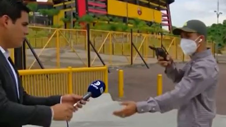 Robbery caught on live TV broadcast - with the reporter as the victim!