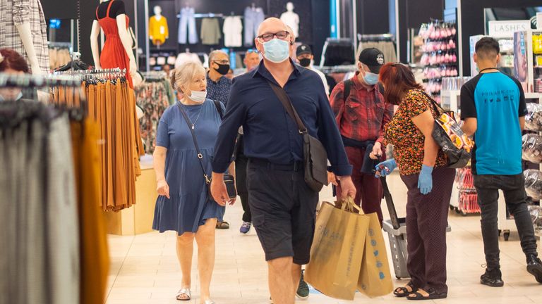 Customers wear face masks as they shop inside Primark in Oxford Street, London
