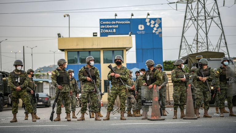 Soldier stand guard outside a prison where inmates were killed during a riot that the government described as a concerted action by criminal organisations, in Guayaquil, Ecuador February 23, 2021. 