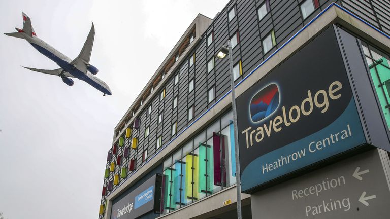 A plane passes over the Travelodge Hotel at Heathrow